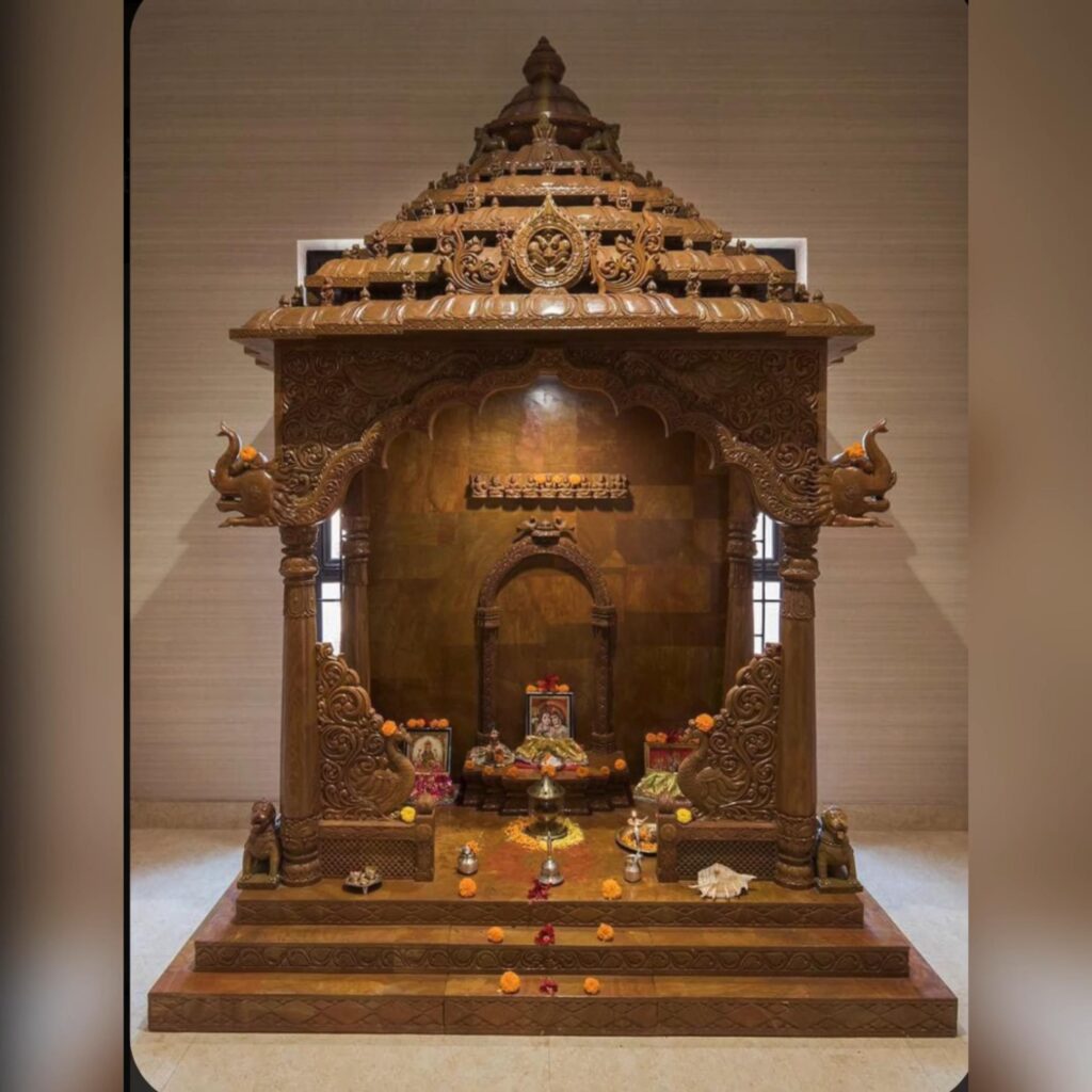 An image showcasing a plywood mandir with brass or metal embellishments, intricate carvings, and figurines.